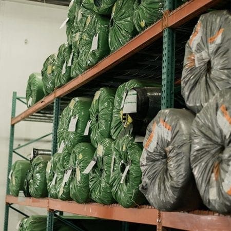 Synthetic turf on pallet racks