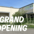 synthetic Turf Northwest Grand Opening at the new Fife, WA location. Image shows "Grand Opening" infront of the warehouse that has a sign on the building that says "Synthetic Turf Northwest"