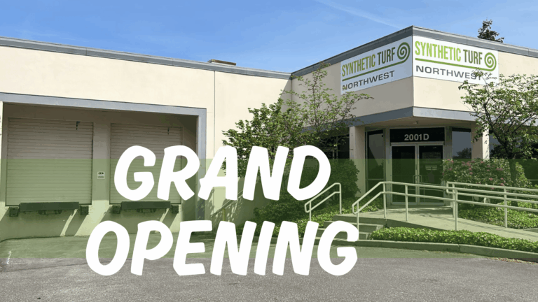 synthetic Turf Northwest Grand Opening at the new Fife, WA location. Image shows "Grand Opening" infront of the warehouse that has a sign on the building that says "Synthetic Turf Northwest"